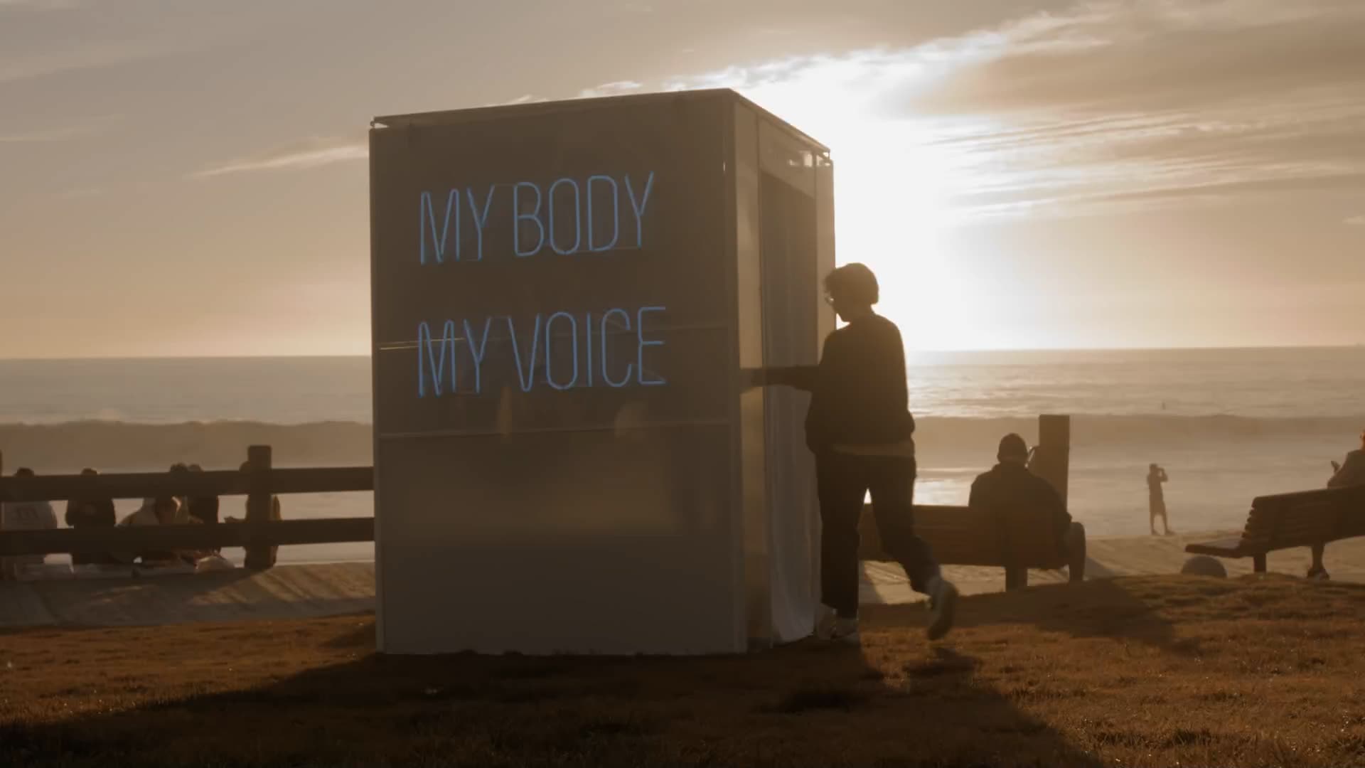 Image of the VoiceBox at Laguna Beach during sunset. Women entering to tell her story.