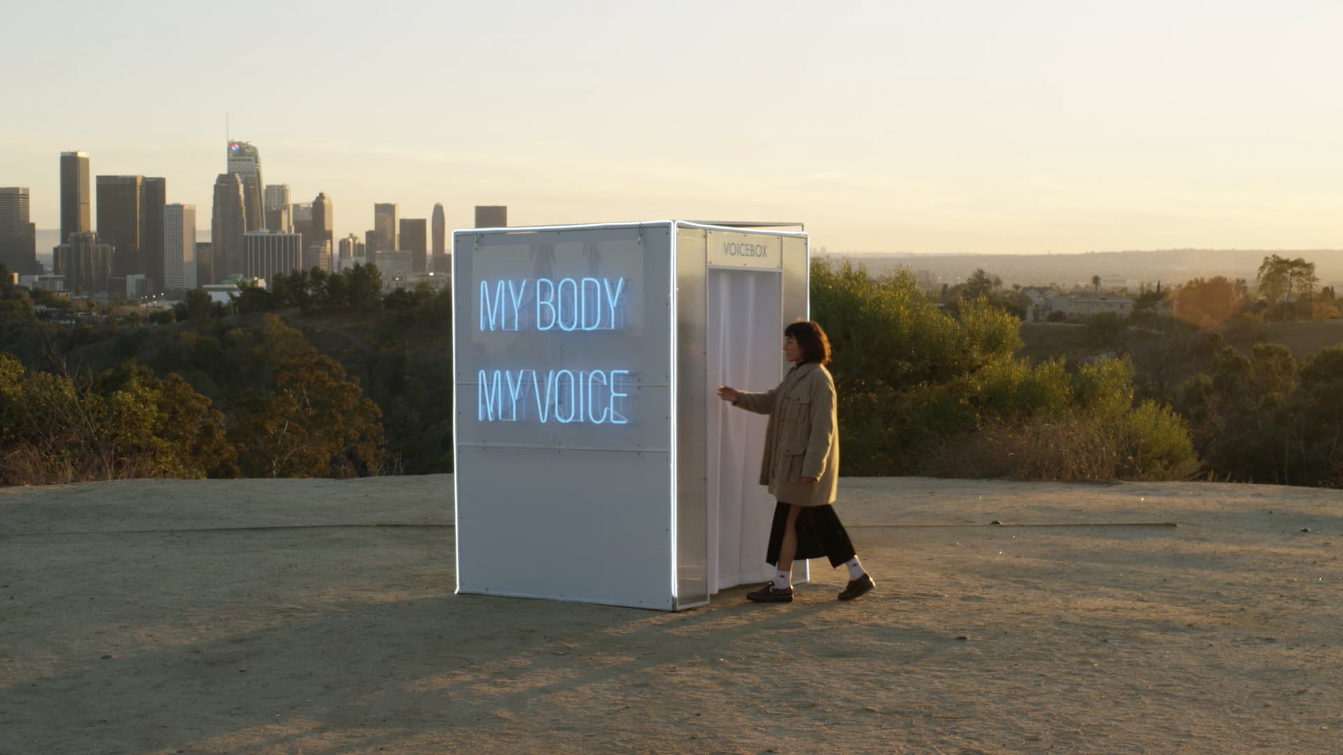 Image of the VoiceBox, at Angels Crest in Los Angeles at sunset. Women entering to tell her story.